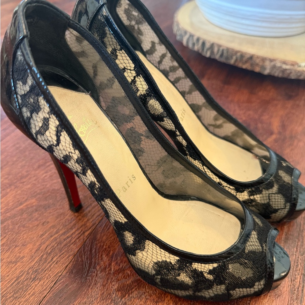 Black lace AUTHENTIC Louboutins.    Gently worn.